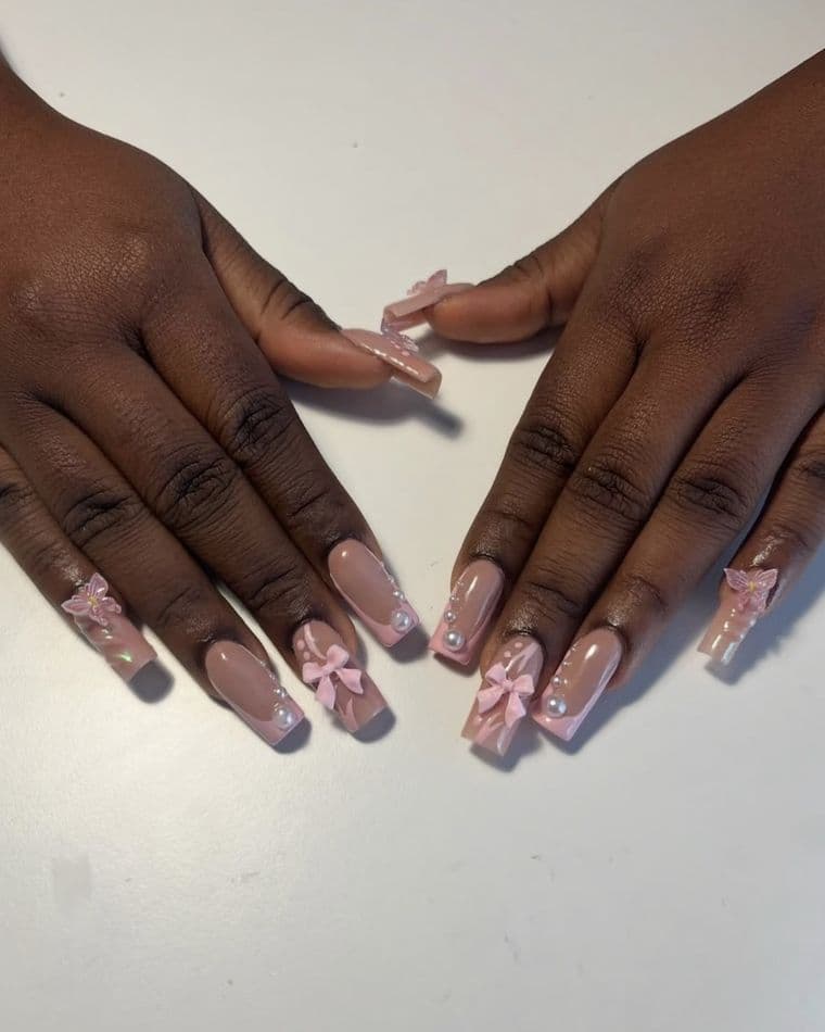 Coffin nails in baby pink with 3D bows, butterflies and pearls