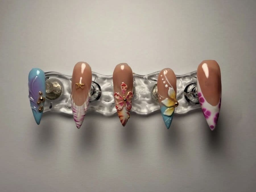 Press-on stiletto set with 3D tropical flowers, a butterfly and a gold star charm