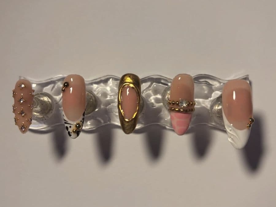 Press-on almond set with a full gold chrome nail, dalmatian print and crystals