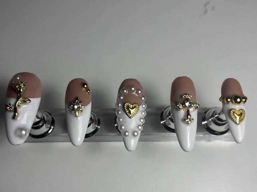 Press-on almond set in white with gold cross and heart charms and pearl trim